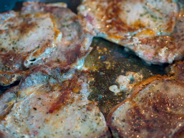 istock red beef steak being cooked in pan close-up view 1095092386
