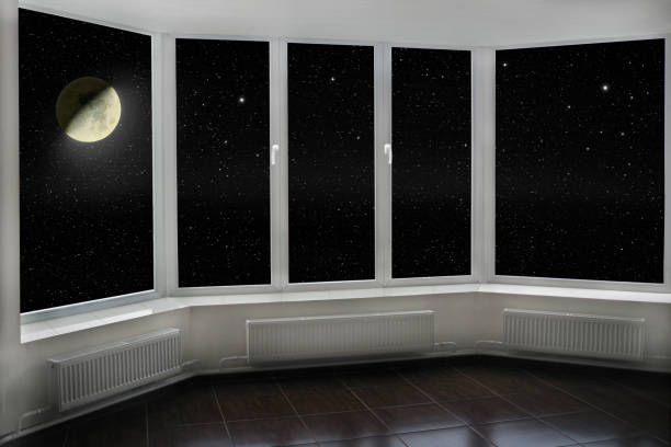 istock window with view to Moon and dark night sky. Stars and moon 1095094710
