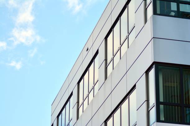istock Modern building with reflected sky and cloud in glass window 1095095016