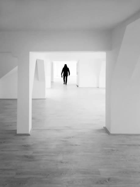 istock Silhouette of man on the empty attic - grayscalle 1095100982