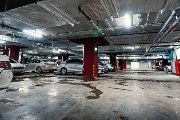 istock Underground public garage parking with cars 1095101222