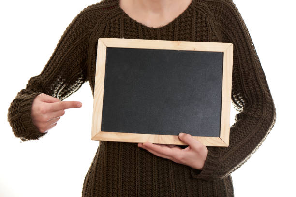 istock Woman Holding Blank Blackboard 1095103580