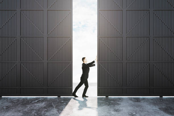 istock Businessman pushing hangar door 1095104284