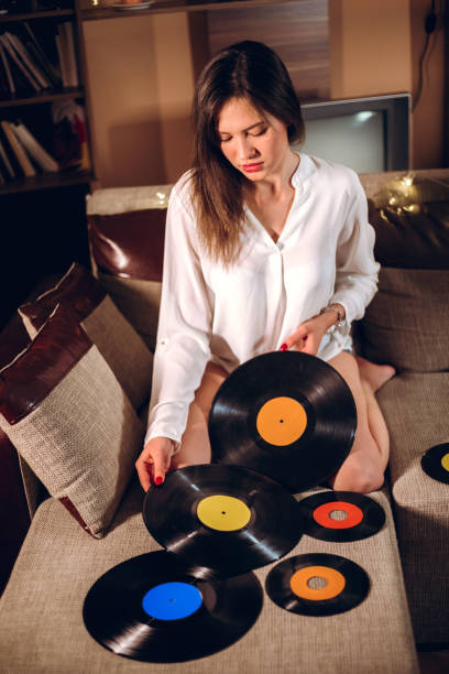 istock Woman with old vinyl records 1095105804