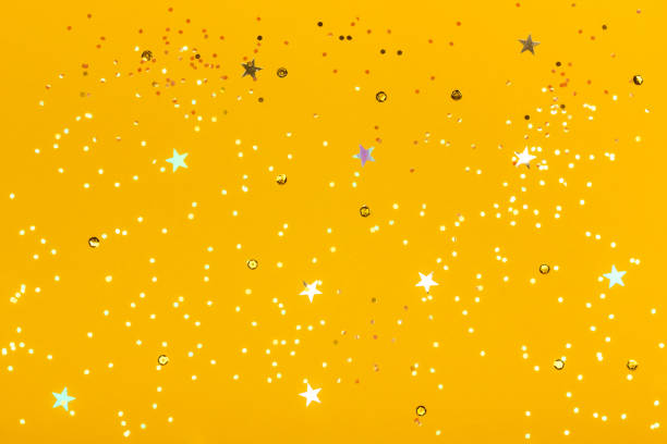 istock Beautiful festive yellow background with confetti. 1095105896