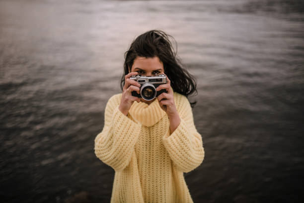 istock Woman with vintage camera 1095108918
