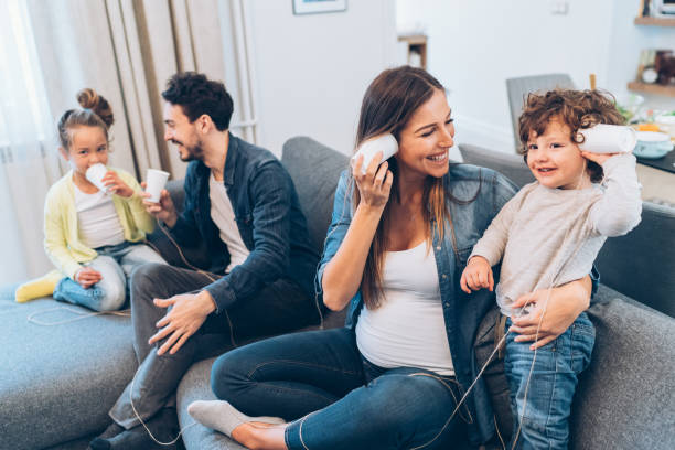 istock Family having fun with string phones 1095115304