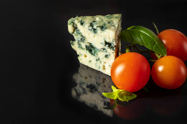 istock Cheese with mold with red cherry tomatoes and Basil 1095124736