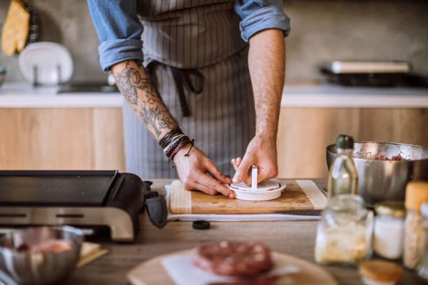 istock Chef Forming Raw Burgers 1095131168
