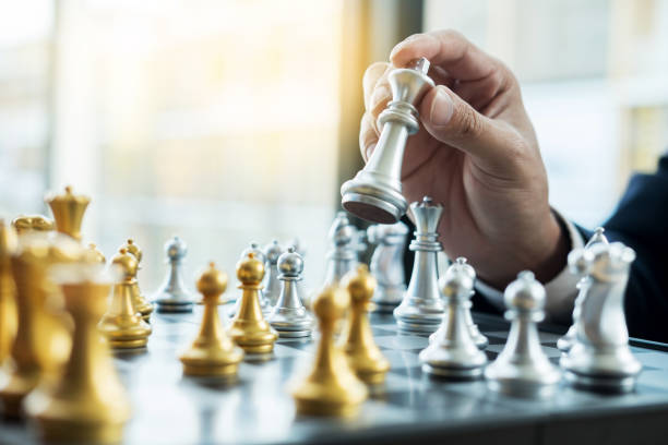 istock Cropped Hand Of Man Playing Chees 1095131330