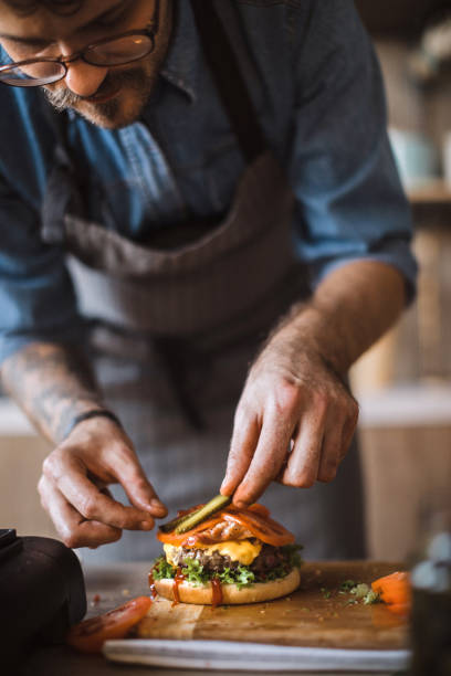 istock Adding Final Details to Delicious Cheeseburgers 1095131406