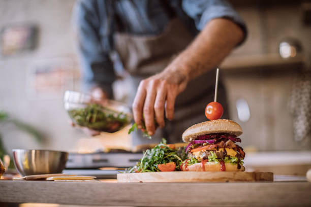 istock Finishing Up Delicious Cheeseburgers 1095131432