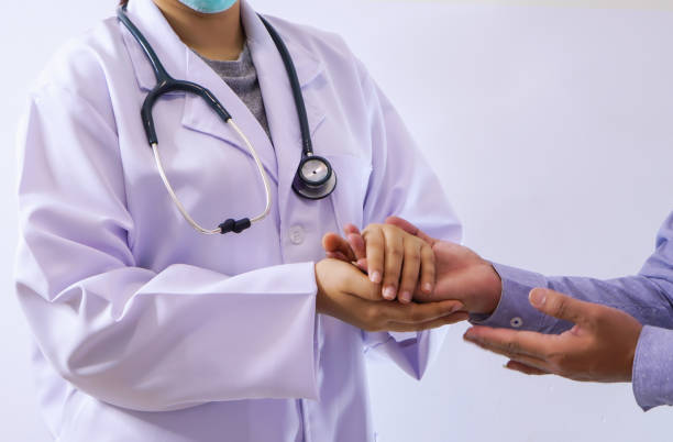 istock Midsection Of Doctor Consoling Patient Over White Background 1095133328