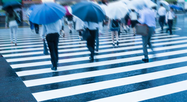 istock Tokyo Crosswalk Scene On A Rainy Morning 1095133844