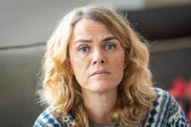 istock Mature blond woman posing looking at the camera 1095134790
