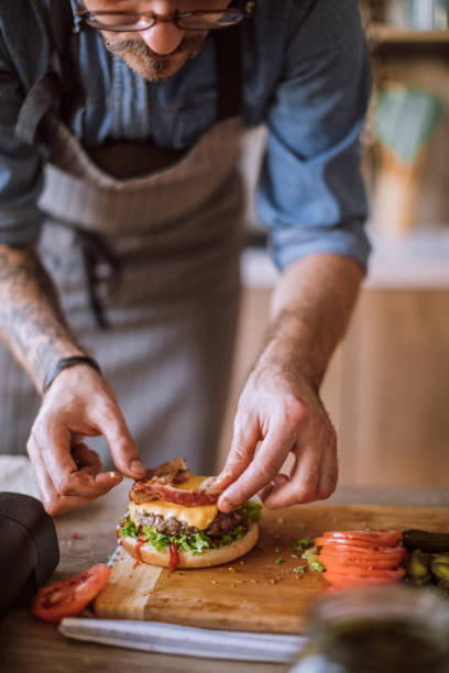 istock Adding Final Details to Delicious Cheeseburgers 1095137722