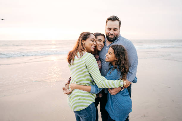 istock Sunset at the beach with family 1095145796
