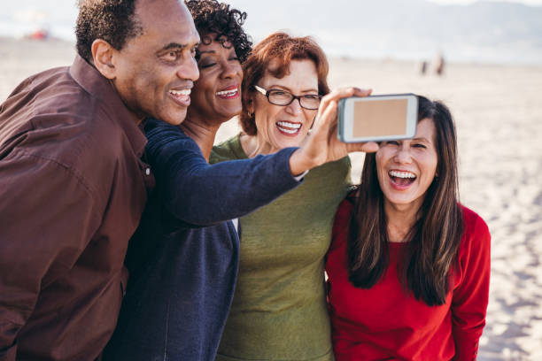 istock Group of seniors having fun on the beach 1095146386