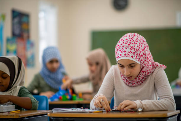 istock Muslim girls working with circuit wires 1095148248