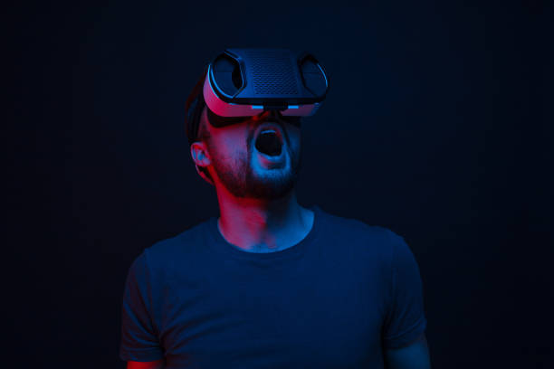 istock Amused man wearing VR glasses 1095150086