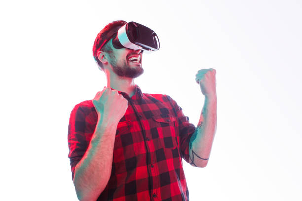 istock Excited man celebrating win in VR glasses 1095150156