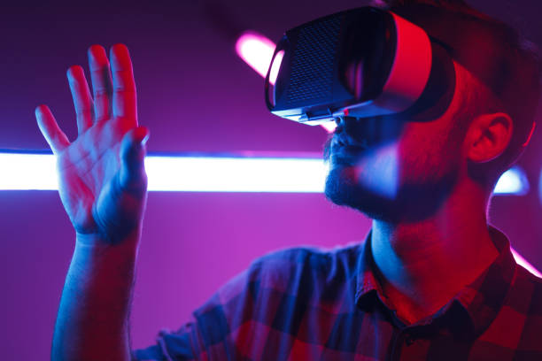 istock Bearded guy touching new world in VR glasses 1095150204