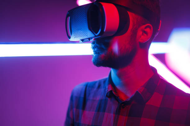 istock Casual man in VR glasses in neon 1095150208