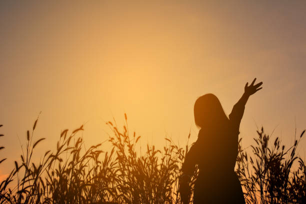 istock Silhouette Woman Against Sky During Sunset 1095150622