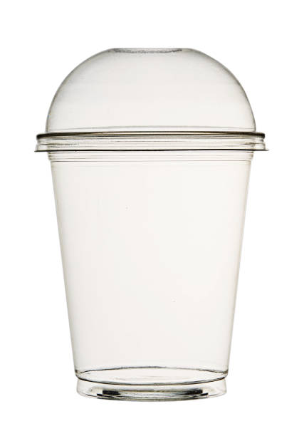 Transparent plastic cup for smoothies and cocktails, with a lid, isolated on a white background.