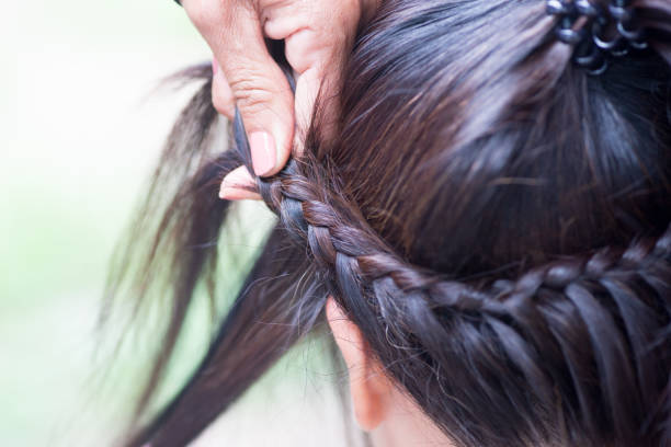 istock Weave girls braids in Home. 1095158942