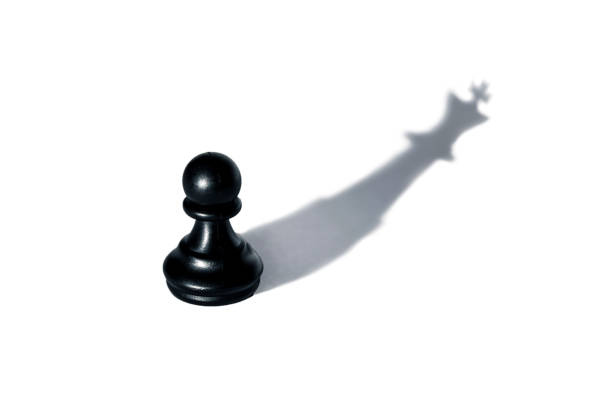 istock Chess - pawn with a shadow of the king 1095168676