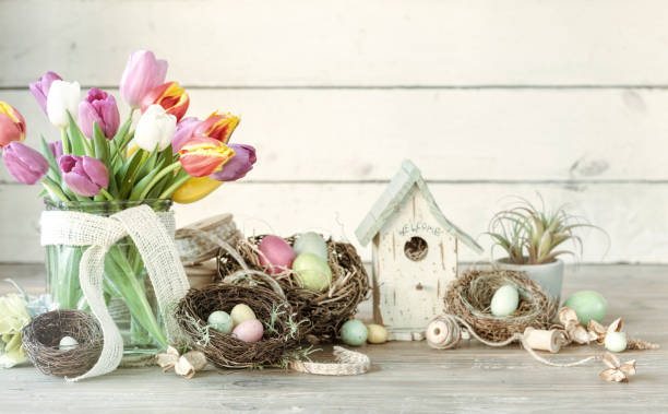 istock Easter Spring Tulips and Easter Eggs on an old White Wood Background 1095168744
