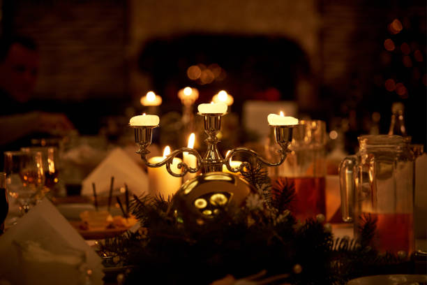 istock Burning candles on a served table in the darkness on a blurred background with bokeh. 1095169086