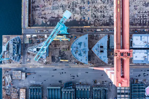 A scenery of a shipyard built on the beachfront