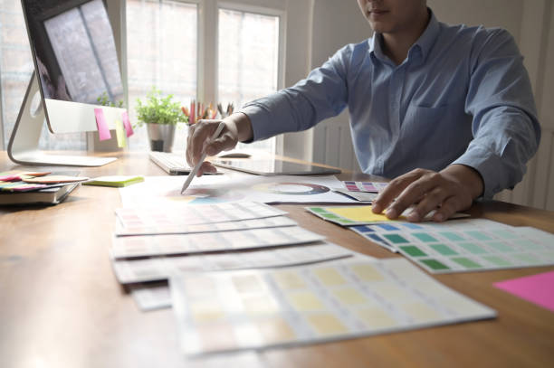 istock Cropped shot creative man working with colour plate with digital tablet on creative workplace. 1095178978
