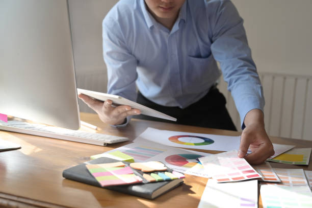 istock Cropped shot creative man working with colour plate with digital tablet on creative workplace. 1095178984