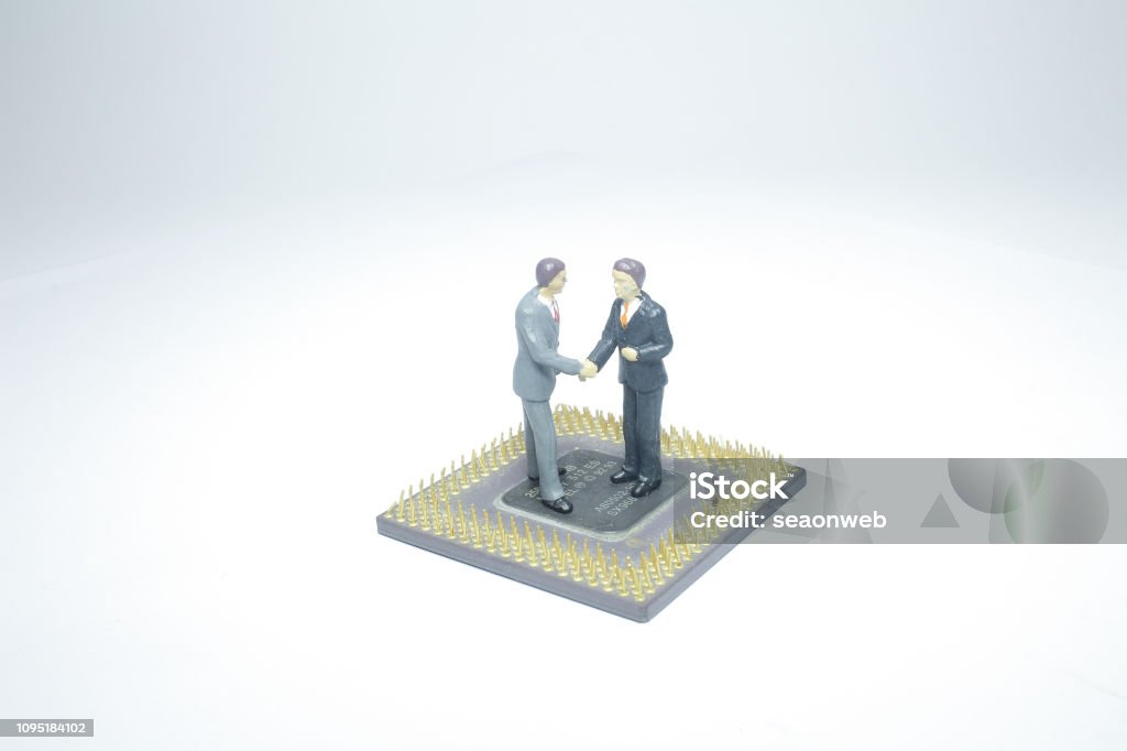 Mini Handshake Mini Figure Handshake On A Computer Chip Stock Photo - Download Image ...