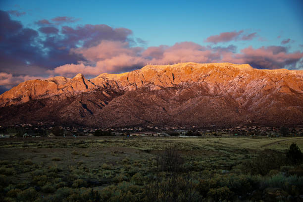 istock Sandia Mountains with Majestic Sky and Clouds at Sunset 1095187612