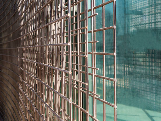 istock Close up of welded wire mesh with glass background, copyspace 1095210992