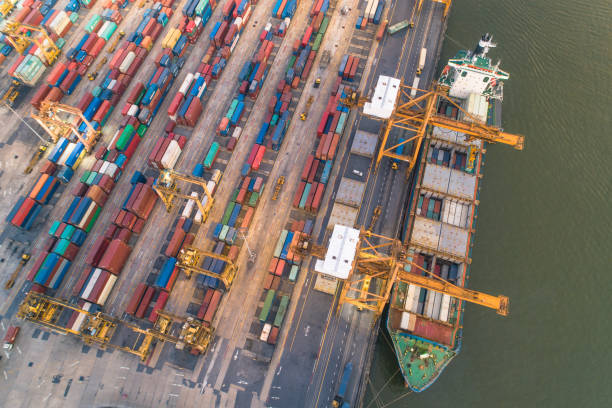 istock Logistics and transportation of Container Cargo ship and Cargo working crane bridge in shipyard 1095226444