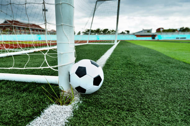 Soccer ball is outside the goal