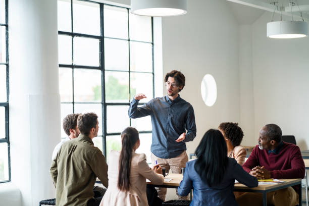 istock Businessman planning with team during meeting 1095236552