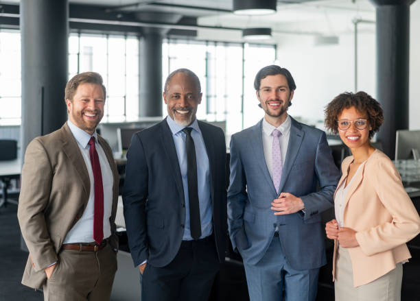 istock Multi-ethnic colleagues standing at new office 1095240196