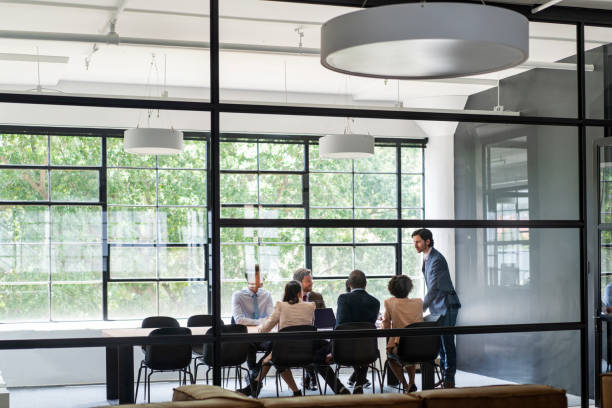 istock Businessman discussing with team in meeting room 1095240430