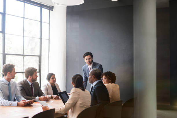 istock Businessman planning with team in board room 1095240636
