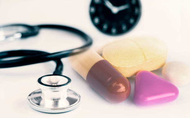 istock Stethoscope and pills isolated on white table background. The stethoscope is a medical instrument for listening to the action of someone's heart or breathing. 1095240724