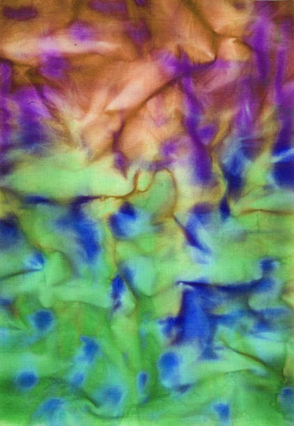 istock Photograph of hand painted fabric with abstract irregular background pattern in blue, green and purple 1095244834
