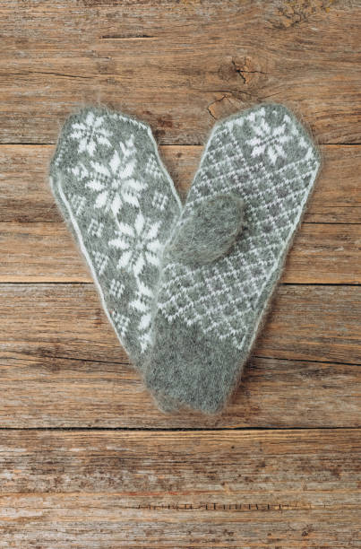 istock heart knitted mittens gray pattern snowflakes love 1095245072
