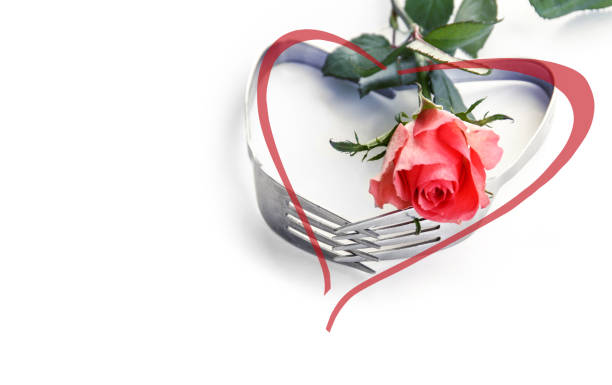 istock Heart shaped forks with a rose 1095251700