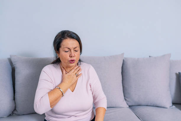 istock Senior woman at home feeling unwell 1095251834